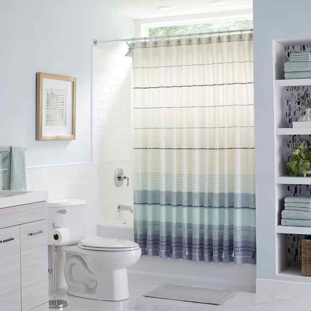 Where should a shower curtain hit